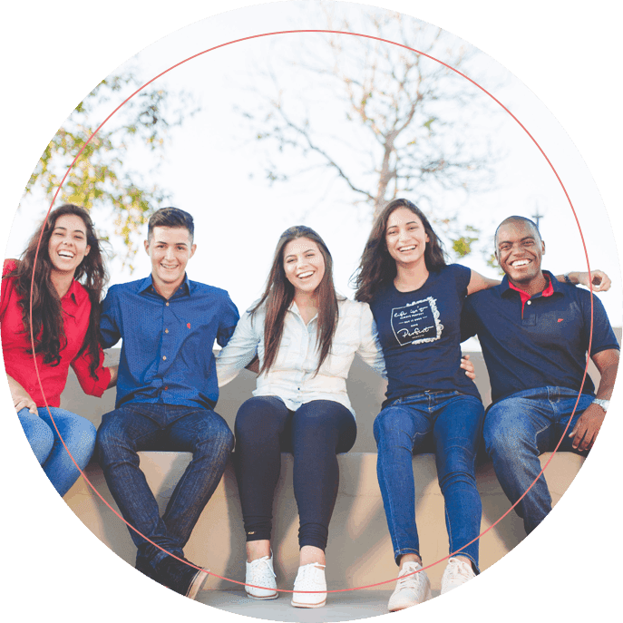 Group of People Sitting Together and Smiling