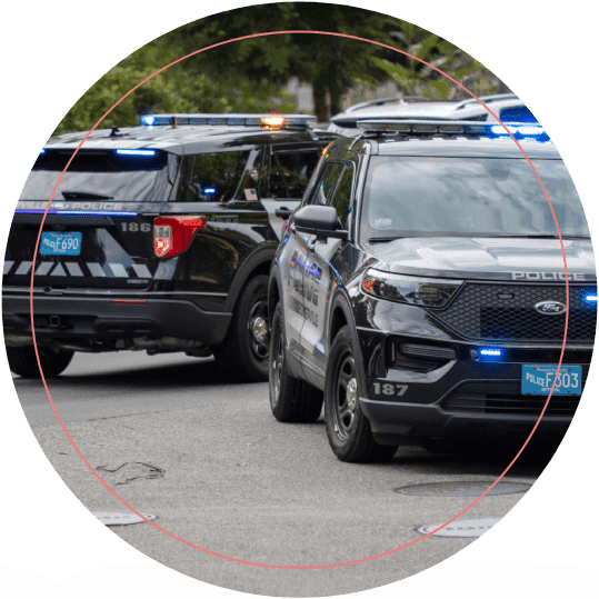 Two Police Cars Parked in an Empty Street