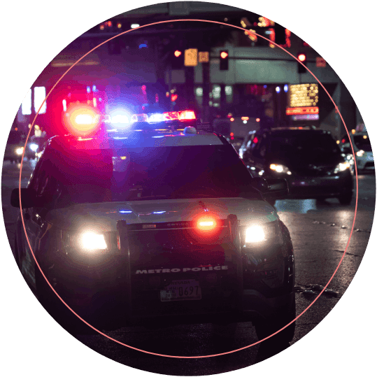 Night Shot of Police Car on Streets